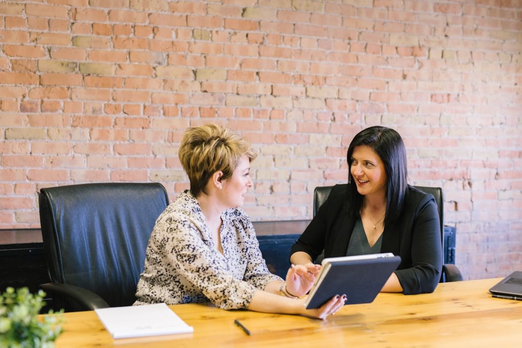 Student discussing a letter of recommendation request with a teacher or mentor