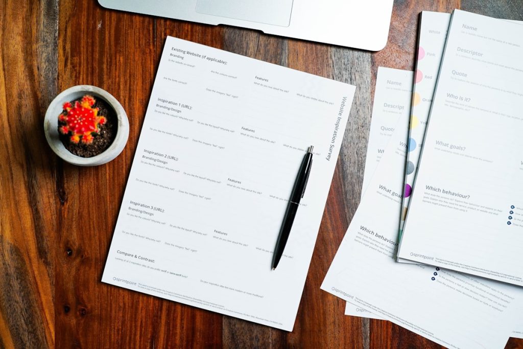 University application paperwork representing Common App and UCAS application systems
