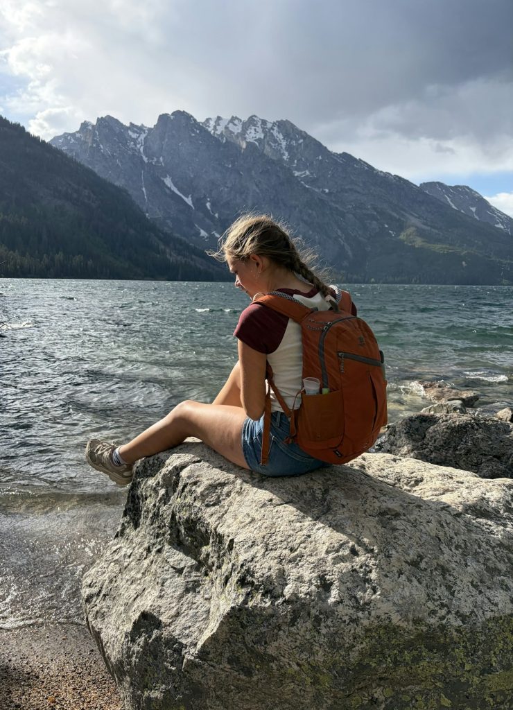 Student with a backpack taking a gap year before starting university